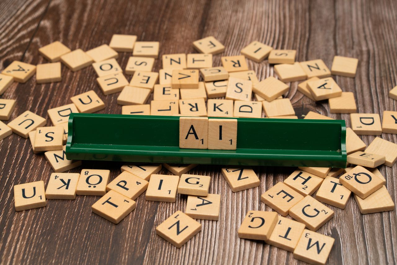 wedding-photography-02 Wooden letter tiles spelling AI, representing technology and innovation.