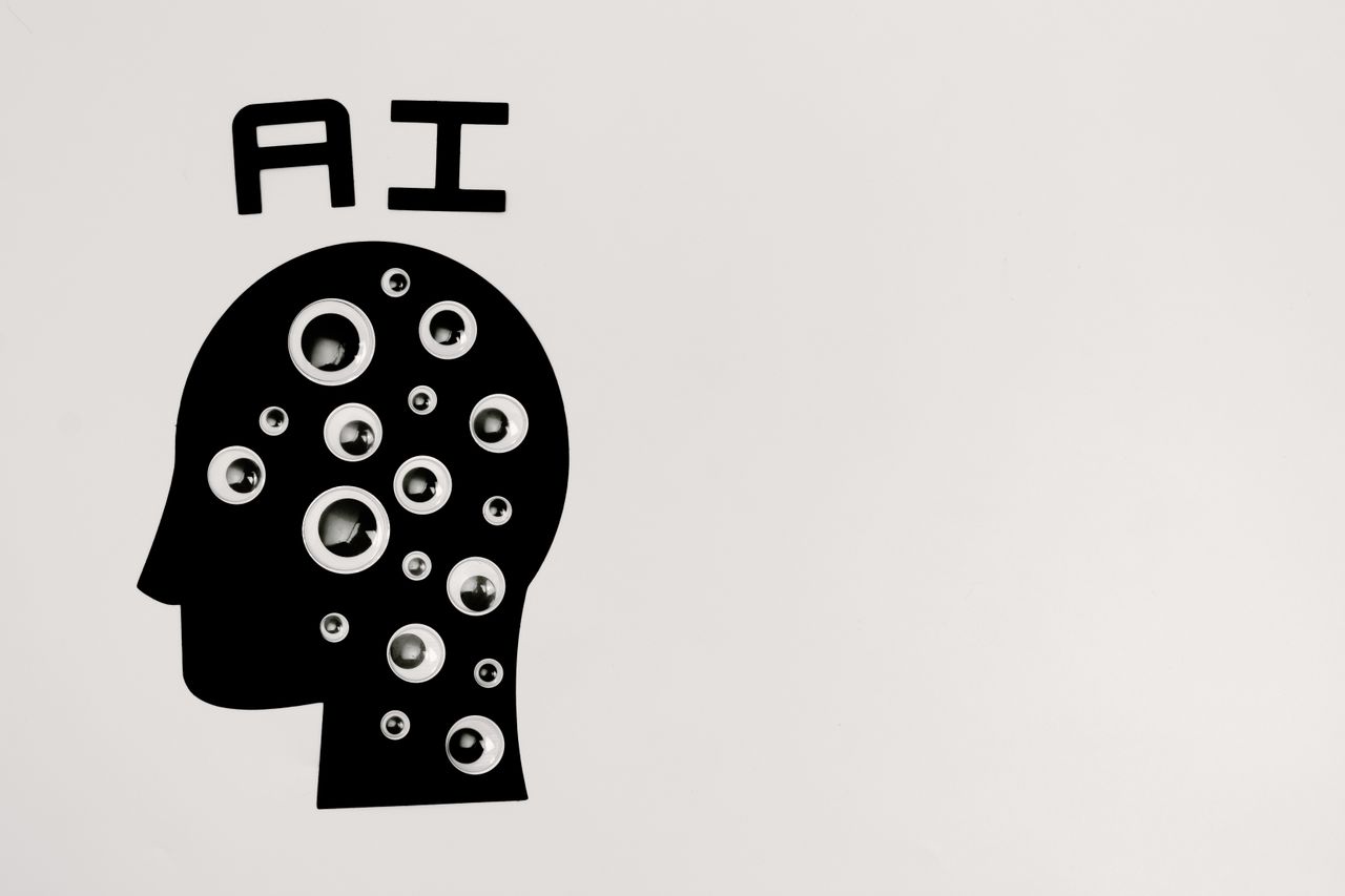 wedding-photography-03 Abstract illustration of AI with silhouette head full of eyes, symbolizing observation and technology.